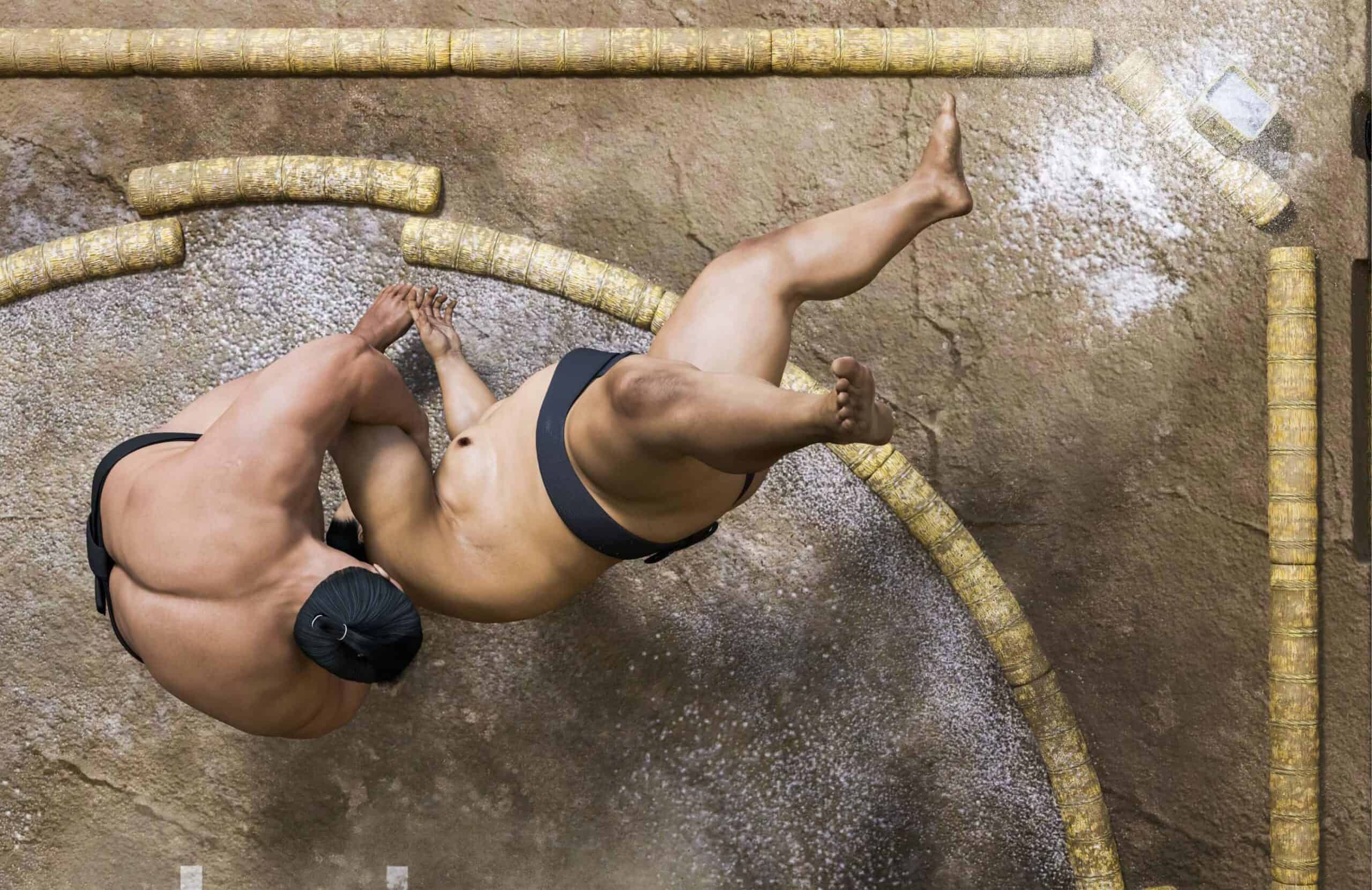 Two sumo wrestlers grappling on the dohyo.